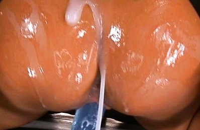 Teen Rica oils her body and fucks a dildo on her table