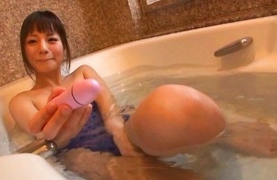 hitomi Asian doll with juicy tits plays with vibrator in water