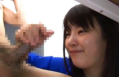 Tsuna Nakamura Asian takes erect penis in her hands and rubs it