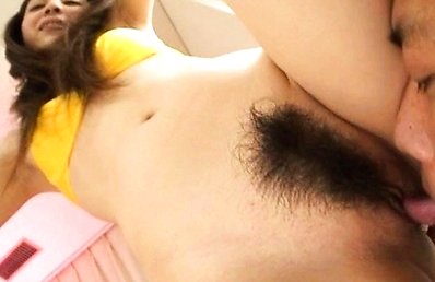 Rina Koizumi spreads her sexy legs to reveal a big hairy pussy