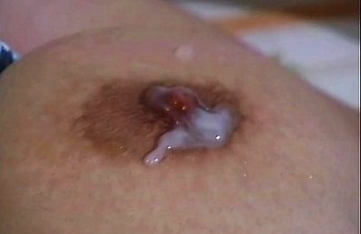 Amateur Asian dame gets cum on dark nipples of her huge assets