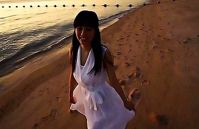 Yumi Sugimoto Asian in white dress is very happy on the beach