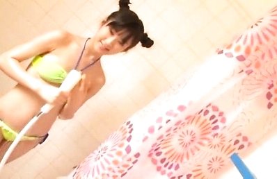 Ai Kitaura Asian puts soap foam and shower over yellow lingerie