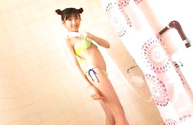 Ai Kitaura Asian puts soap foam and shower over yellow lingerie
