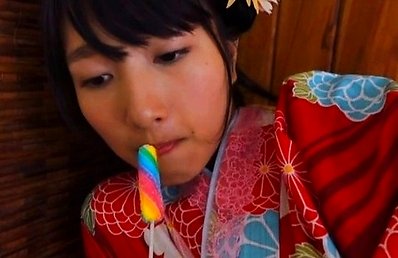 Nana Tanaka Asian undresses kimono while licking candy so sexy