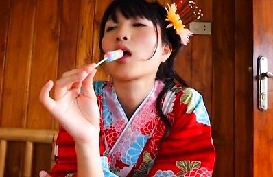 Nana Tanaka Asian undresses kimono while licking candy so sexy