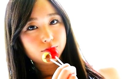 Yumi Ishikawa Asian licks two candies with her naughty tongue