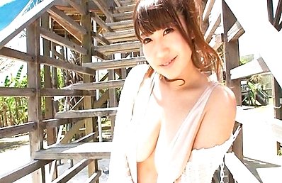 Natsumi Rino Asian shows hot cleavage and appetizing butt outdoor