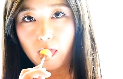 Yumi Ishikawa Asian licks two candies with her naughty tongue