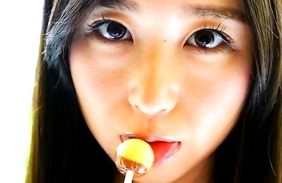 Yumi Ishikawa Asian licks two candies with her naughty tongue