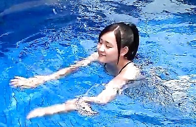 Nozomi Fujimori with big tits and nasty butt swims in the pool