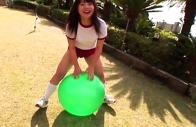 Mana Asian doll plays with big ball outdoor shows body in lace
