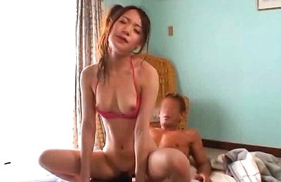 Japanese AV Model has hot cans out of bra while is doggy fucked