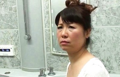 Japanese AV Model gives blowjob in bathroom while touching balls