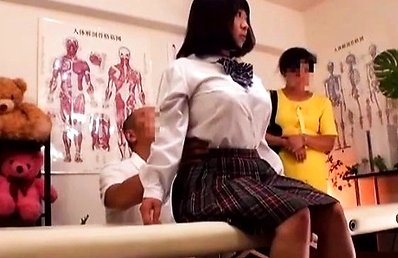 Amateur Asian doll is touched by masseur over school uniform