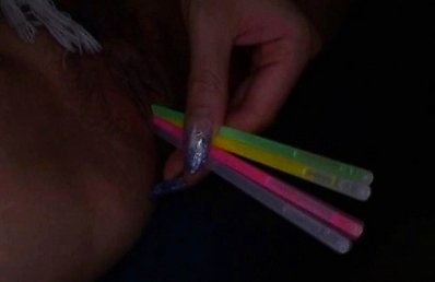 Hatsuka slides glow sticks into her tight teen japanese pussy